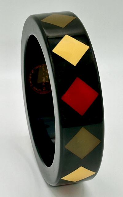 AB117 Lain near black bangle with diamond shaped inlays in red, ivory, palest olive