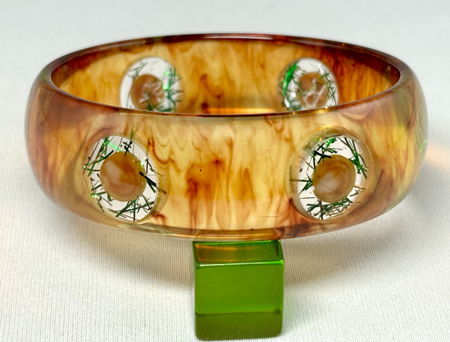 AP19 amber bakelite bangle with 6 bullseye lucite glitter dots