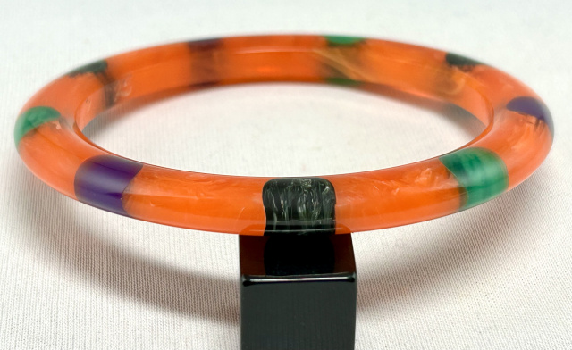 Atelier Papillon cloudy marbled orange dotted bakelite tube bangle