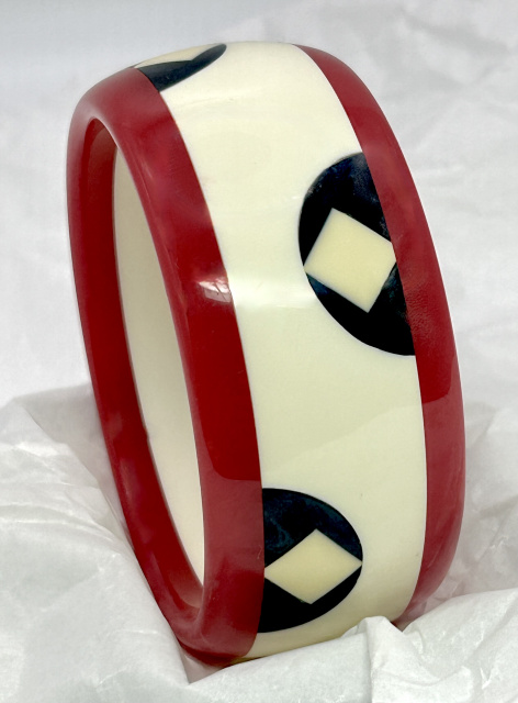 AP21 red, white and blue bordered, dotted and square inlaid bakelite bangle