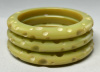 AB41 crater carved pale green bakelite bangles