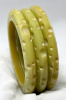 AB41 crater carved pale green bakelite bangles