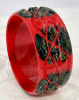 Jessie Fowler red with marbled black and yellow carved dots bakelite bangle