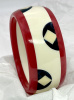 AP21 red, white and blue bordered, dotted and square inlaid bakelite bangle